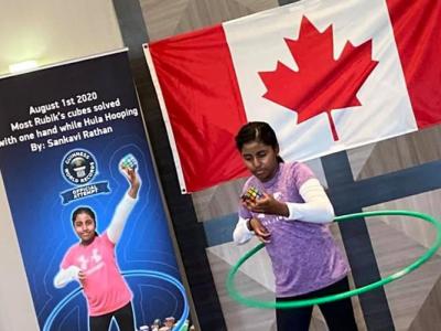 加拿大11岁印度裔女童Sankavi Rathan边转呼拉圈边单手还原魔方创吉尼斯世界纪录