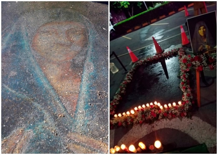 民众以鲜花和蜡烛（右）围绕以粉笔绘画的圣母玛利亚像（左）。